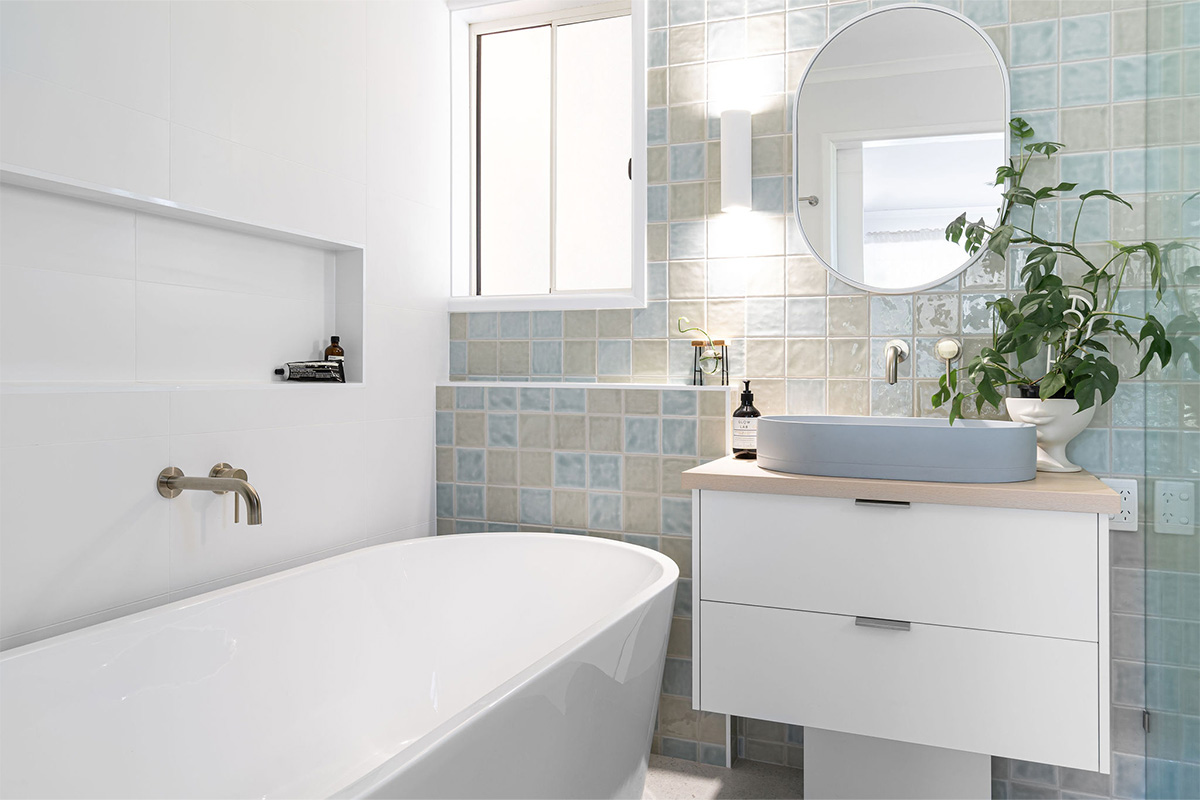 Bathroom renovation Sunshine Coast with white tiles and cabinetry